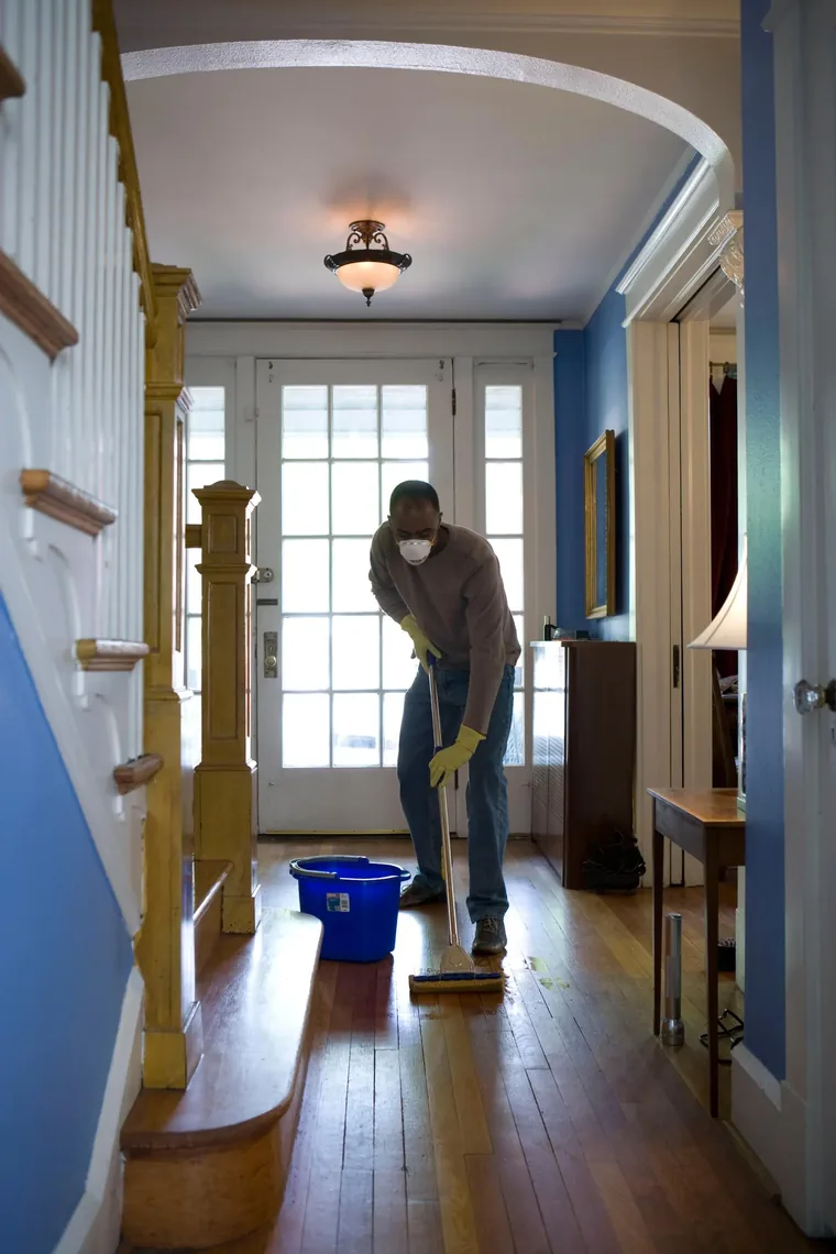 A cleaner at work in a bright room